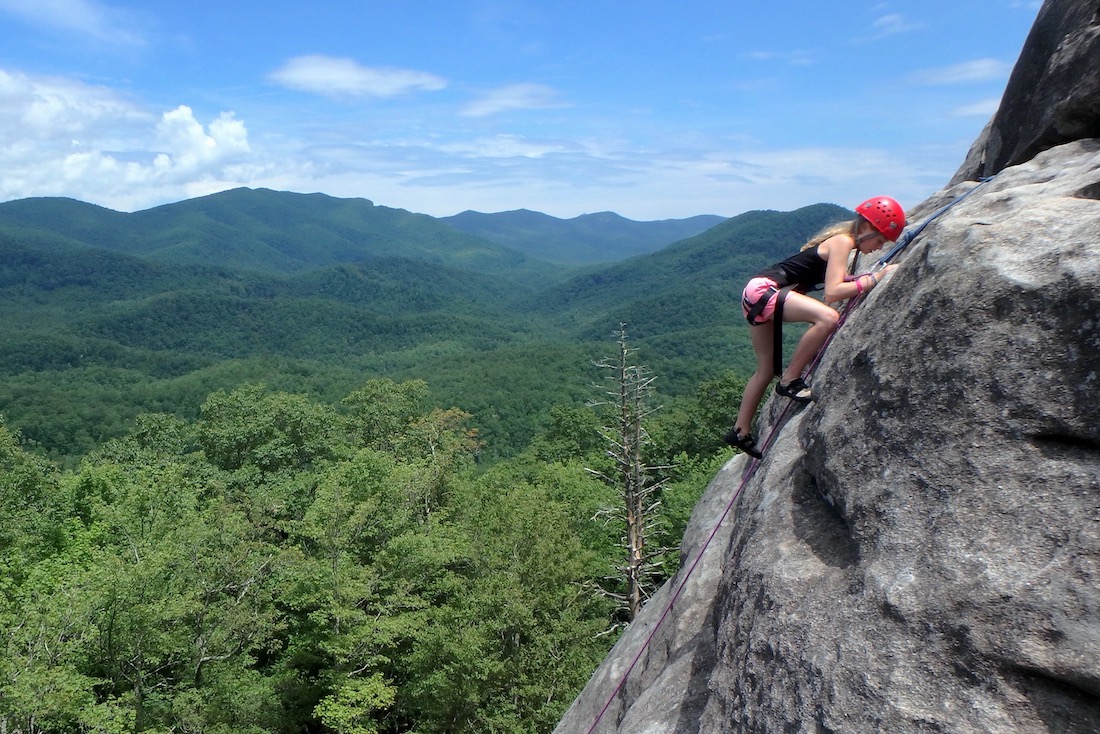 Girl camper rock climbing in NC