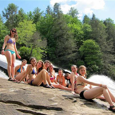 Teen camp girls at waterfall