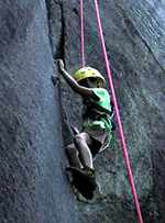 Camp kid rock climbing