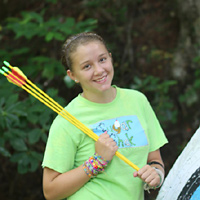 Learning archery and arrows at summer camp