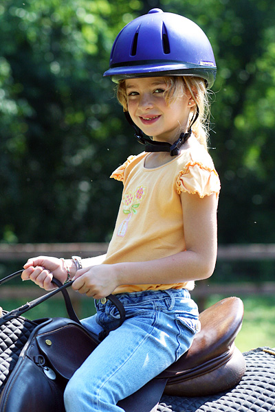 Little Summer Camp girl horseback riding