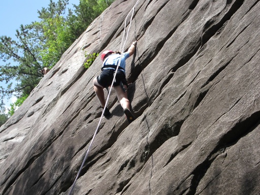 camp kid up climbing rock