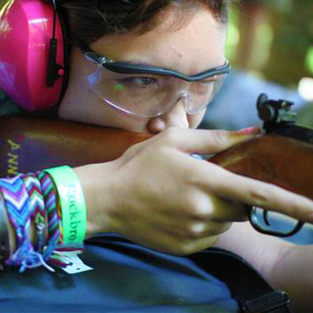 Camp Girl Aiming a Rifle