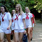 Campers wearing white and red camp uniform