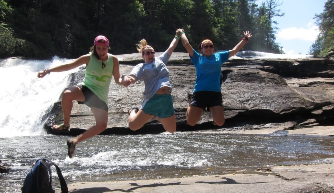 camp counselors jumping