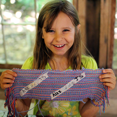 Girl proud of her weaving