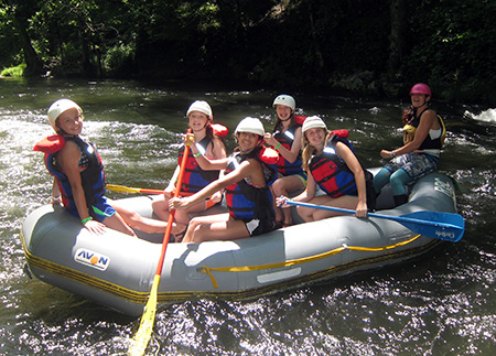 Camp Kids smiling in whitewater raft