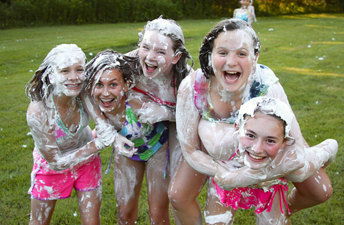 Camp girls covered in shaving cream