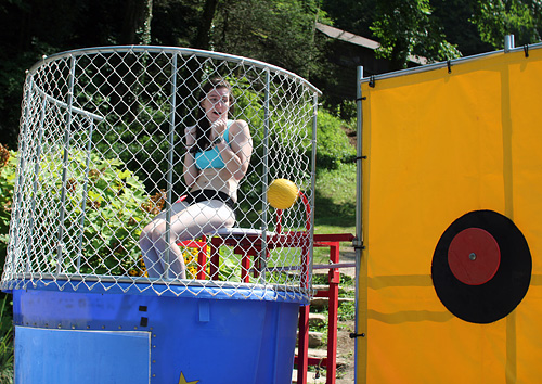 Camp counselor girl in dunking booth