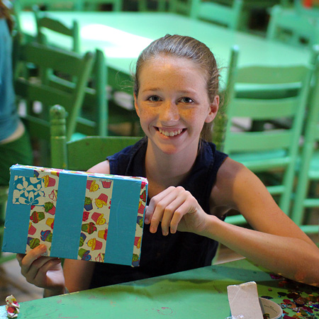 Girl holding a decorated paper box