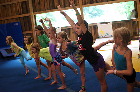 Learning gymnastics at summer camp