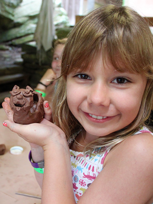 Camper proudly displays pottery sculpture