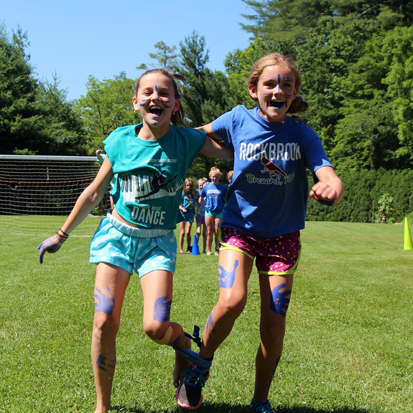Campers running 3-legged race