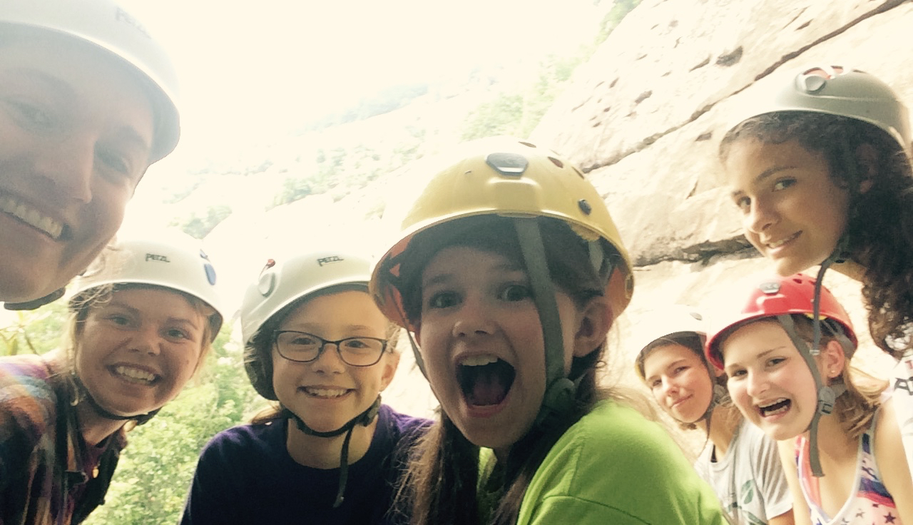 smiling rock climbers
