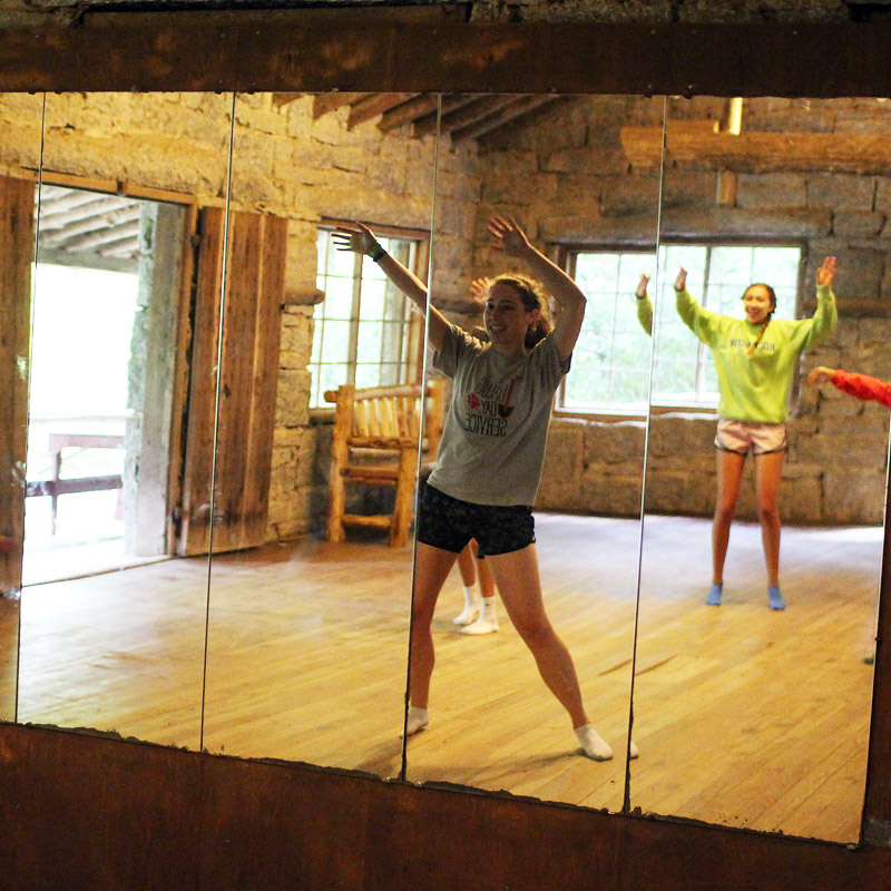 Camp dancing girls in mirror
