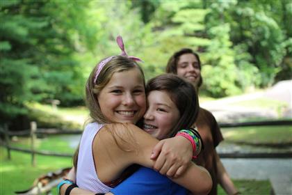 camp girls hugs