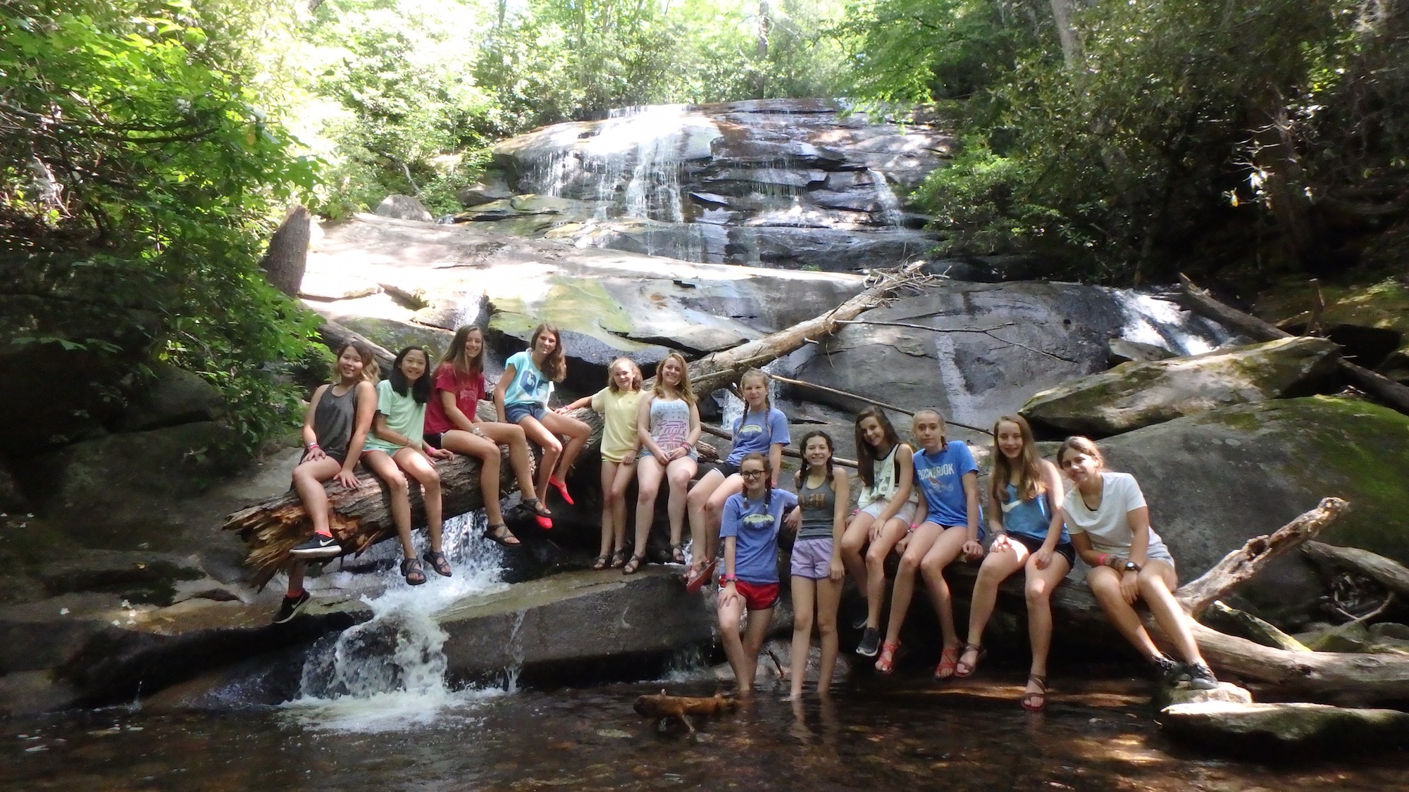 teenagers waterfall pool below