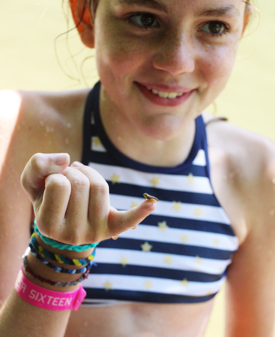 Girl Holding Small Tadpole on Finger