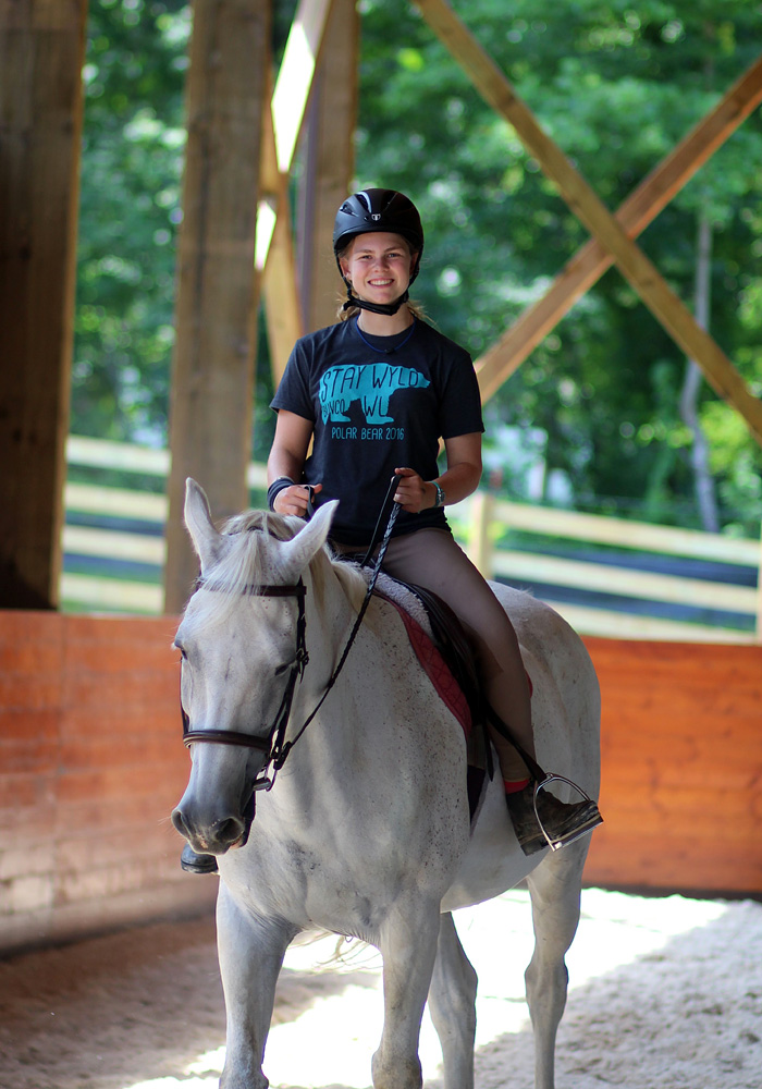 Camp horseback riding girl