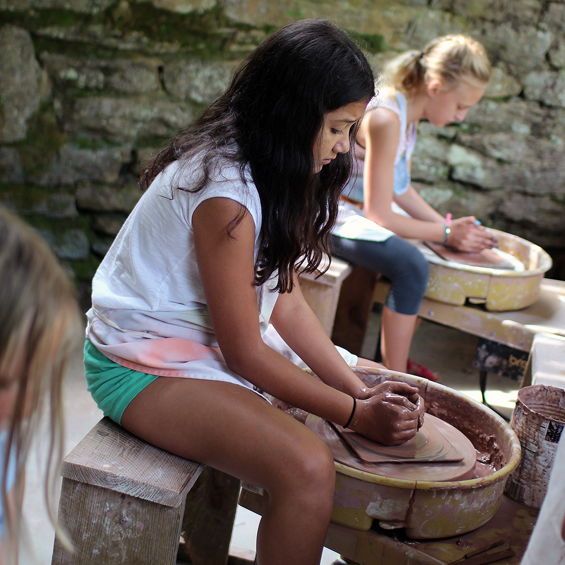 pottery girls on the wheel