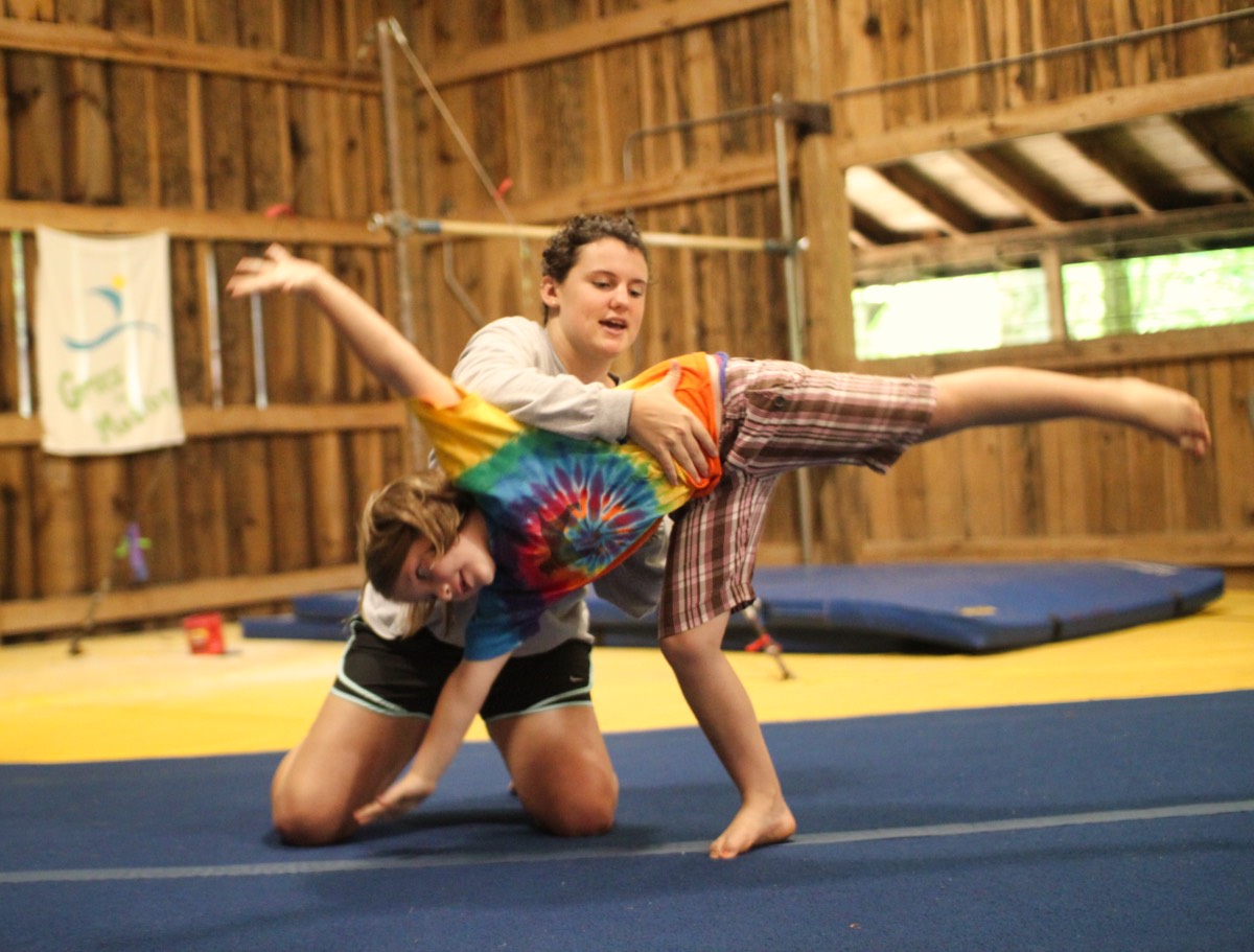 camp girl learning cartwheel