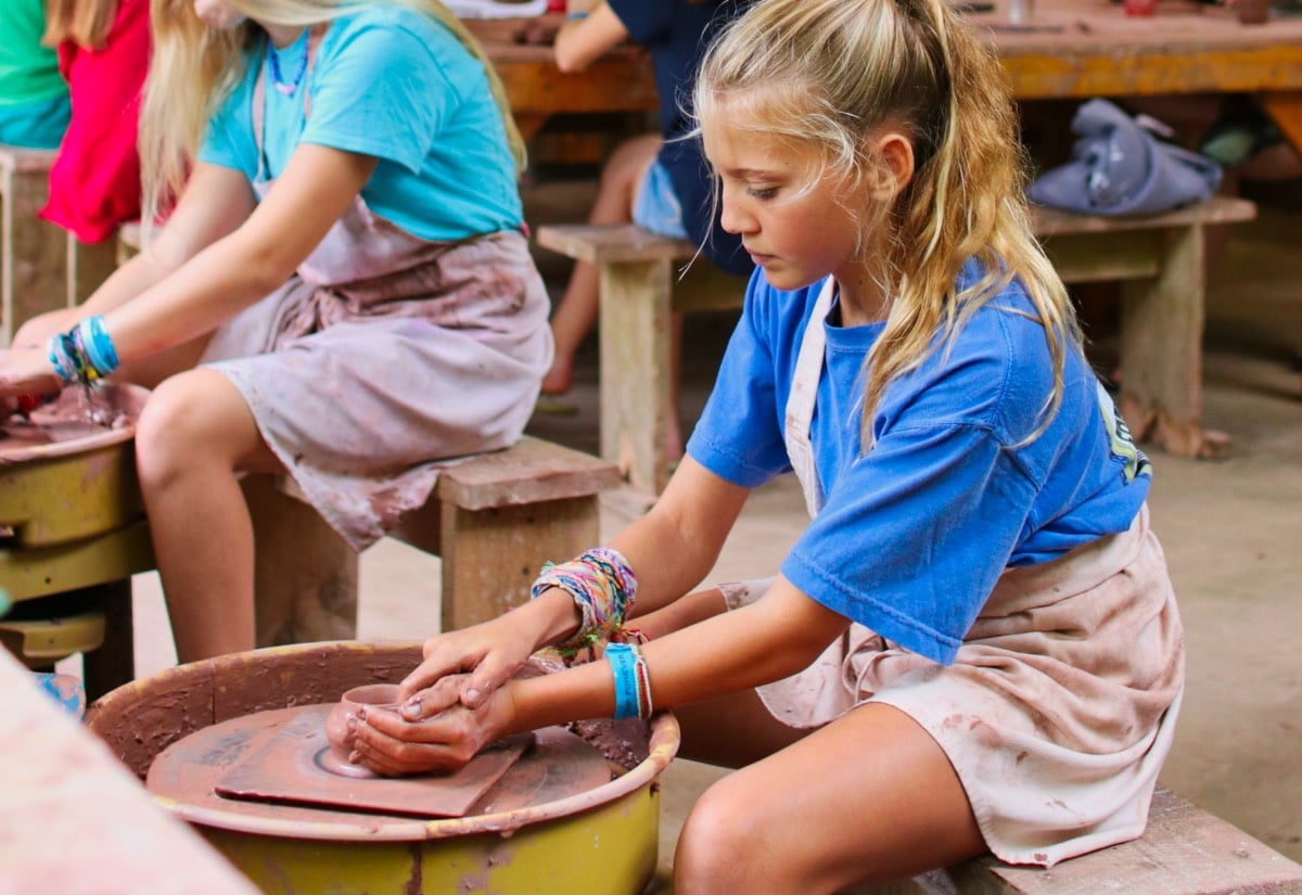 kid on pottery wheel