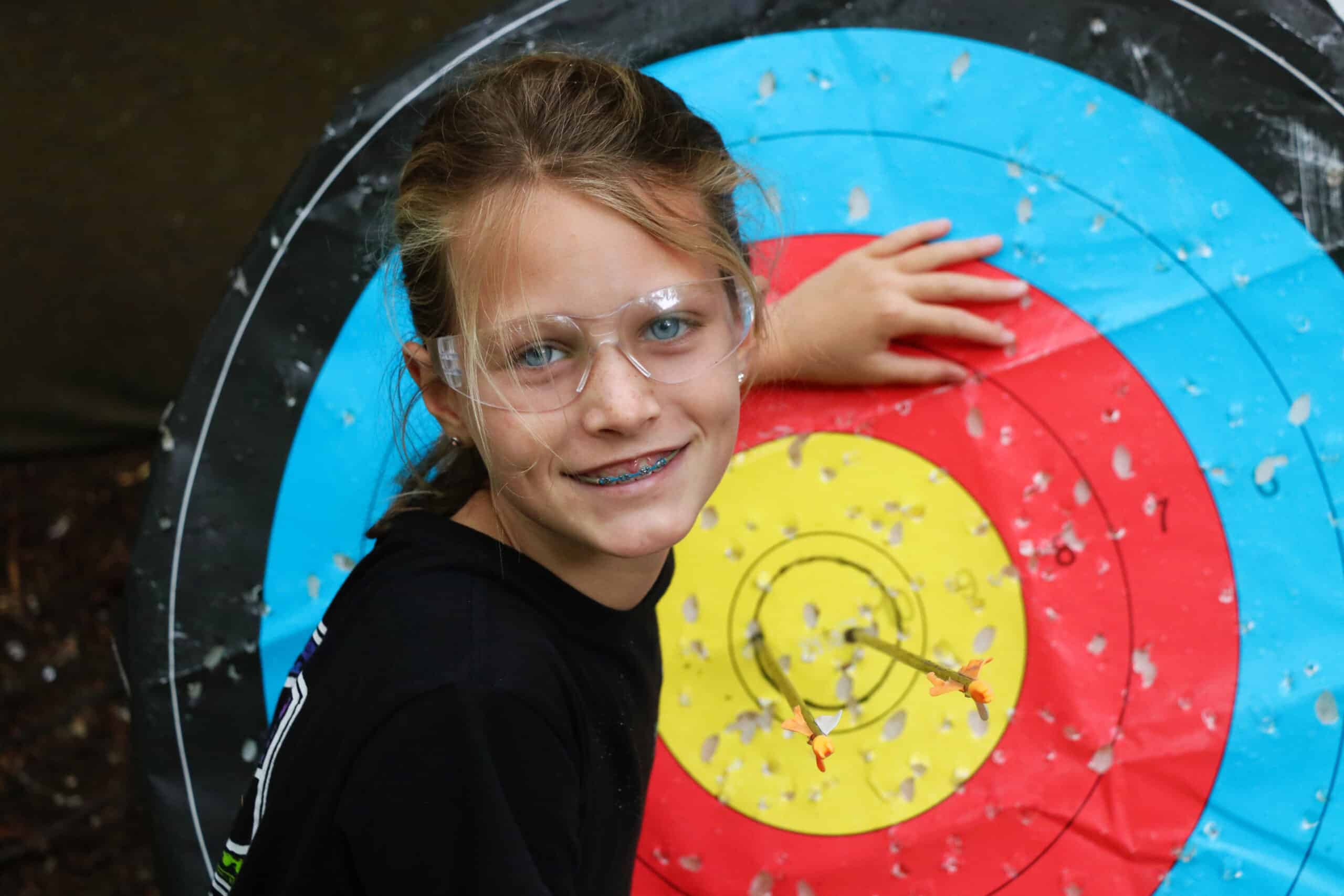 Girl proud of here bullseye in archery