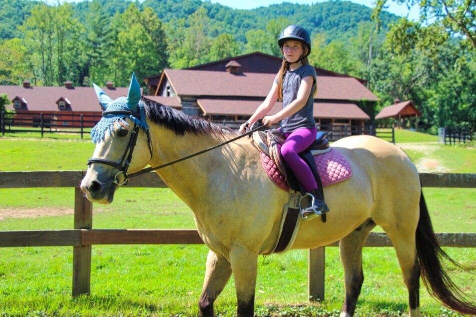 mountain girl riding a horse