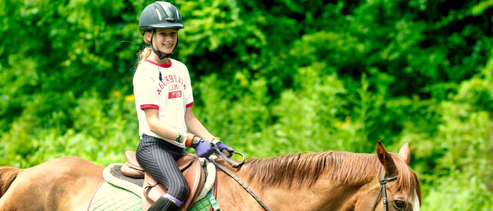 camp girl horseback riding