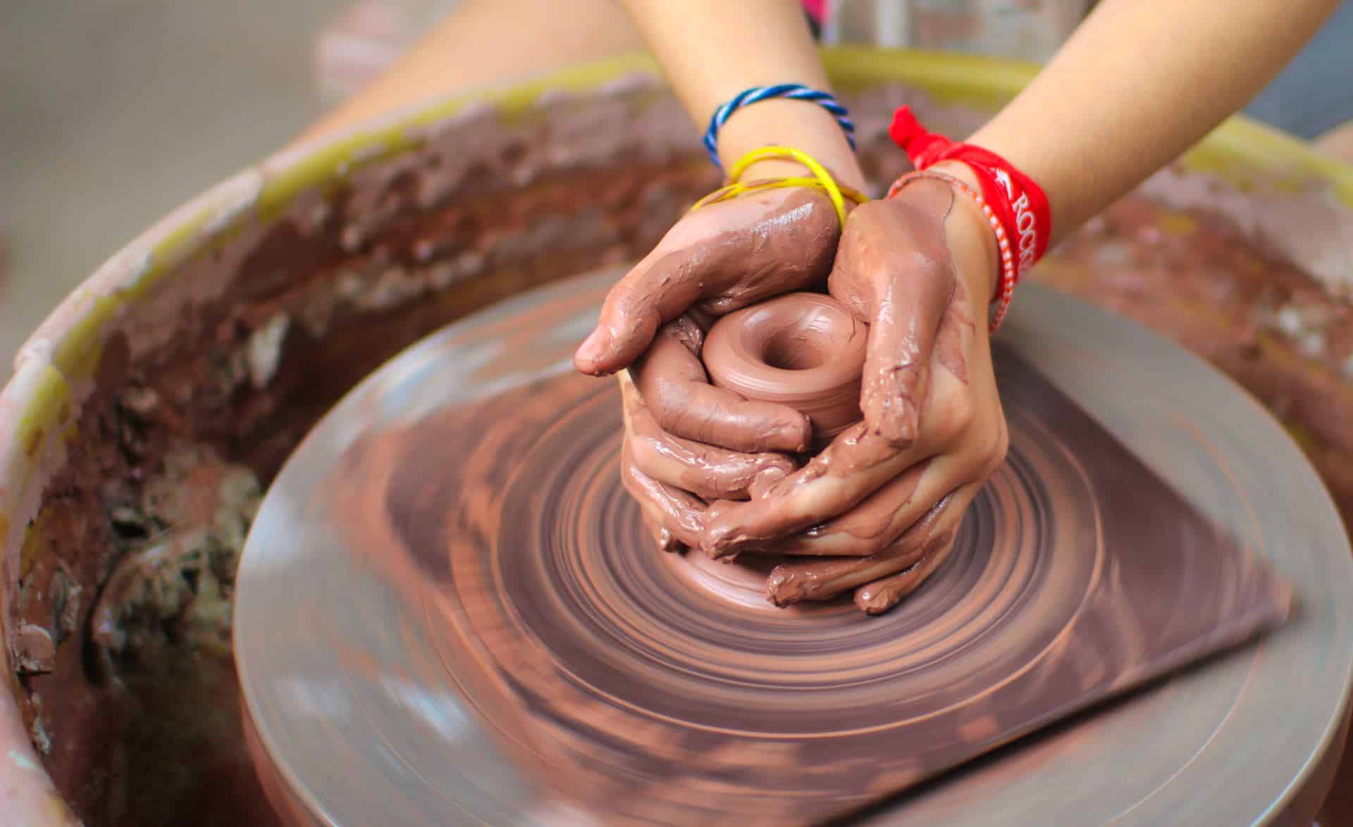 spinning pottery wheel at camp ceramics program