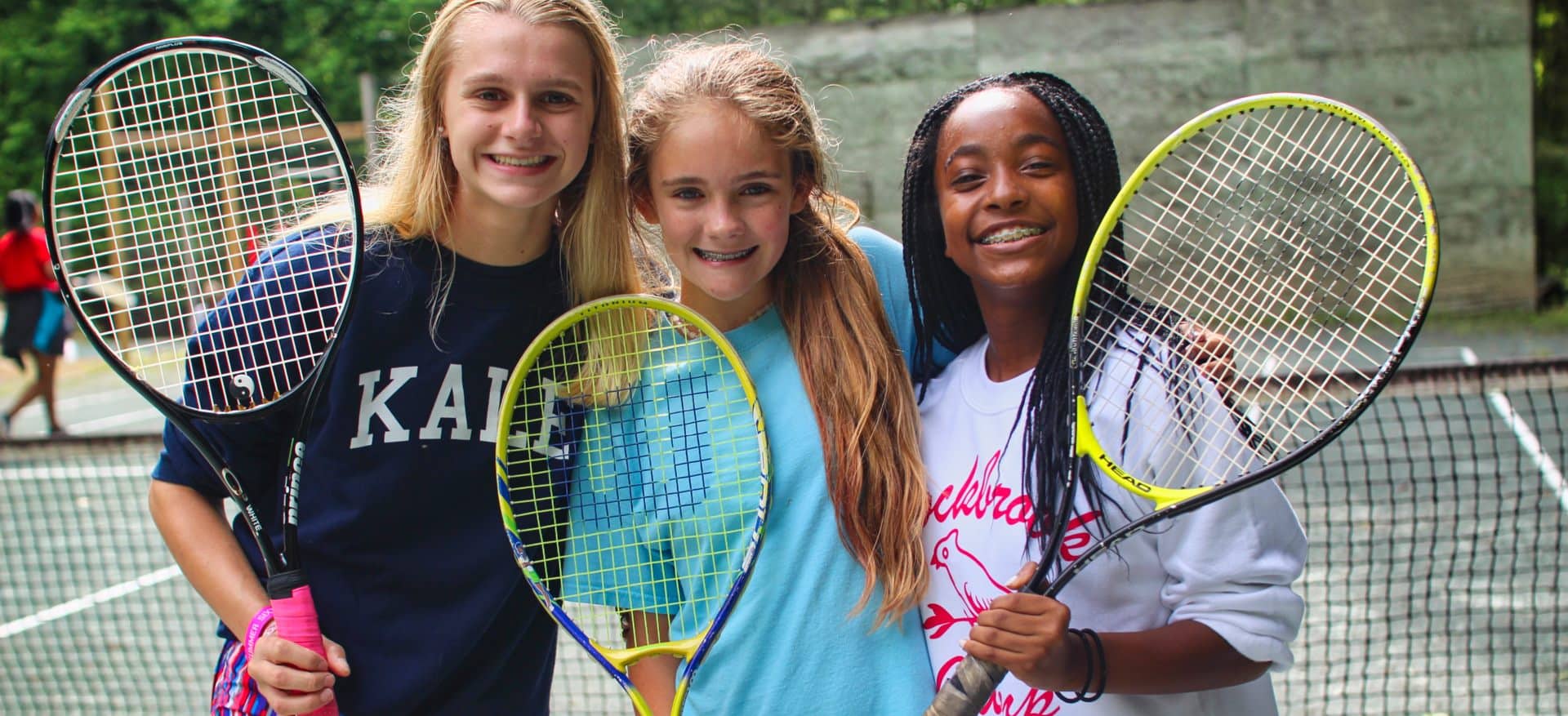 teen tennis girls at camp