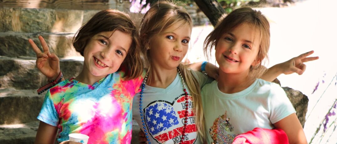 three girls best friends at summer camp