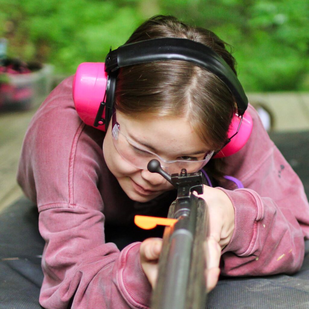 pre-teen rifle shooting girl