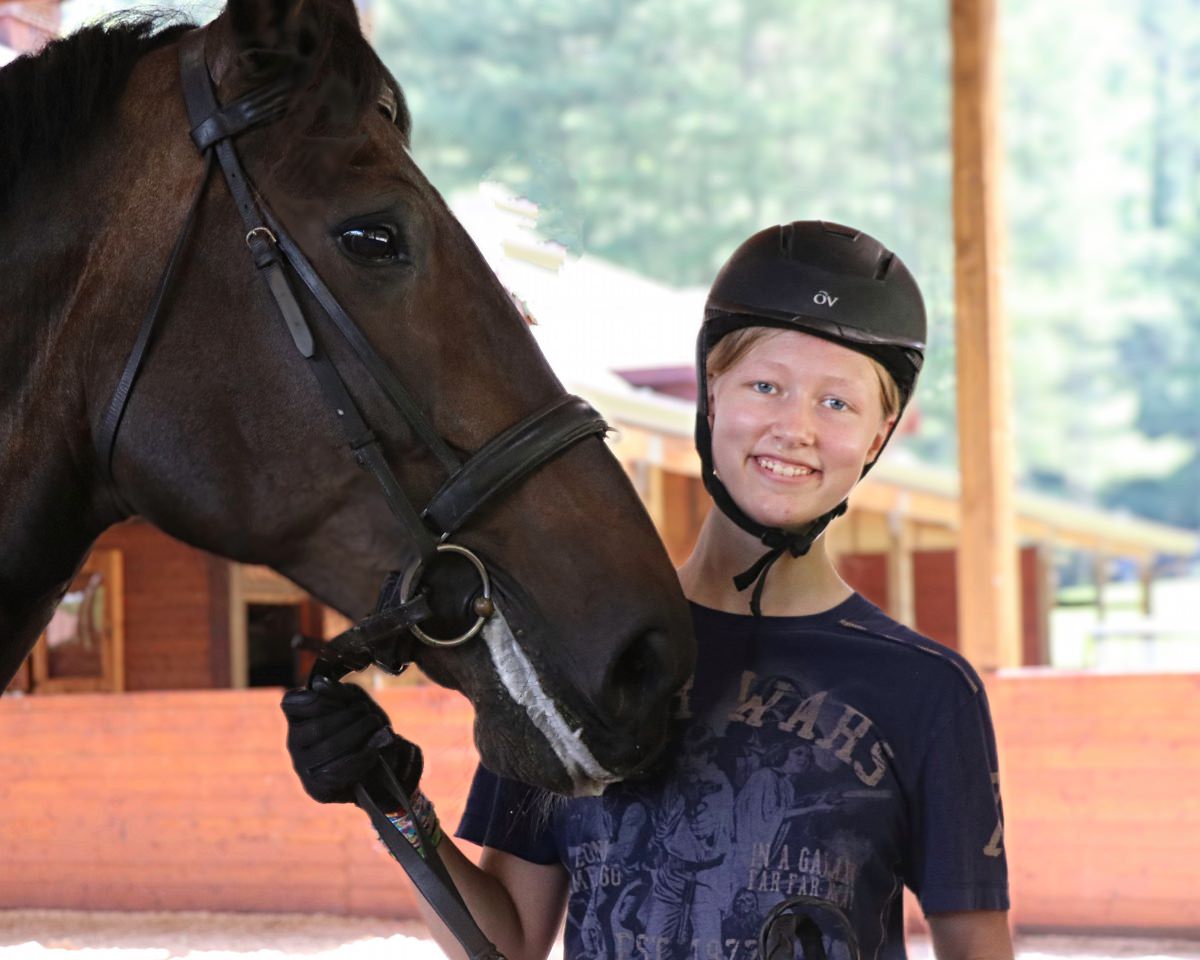 horse and teen girl at camp