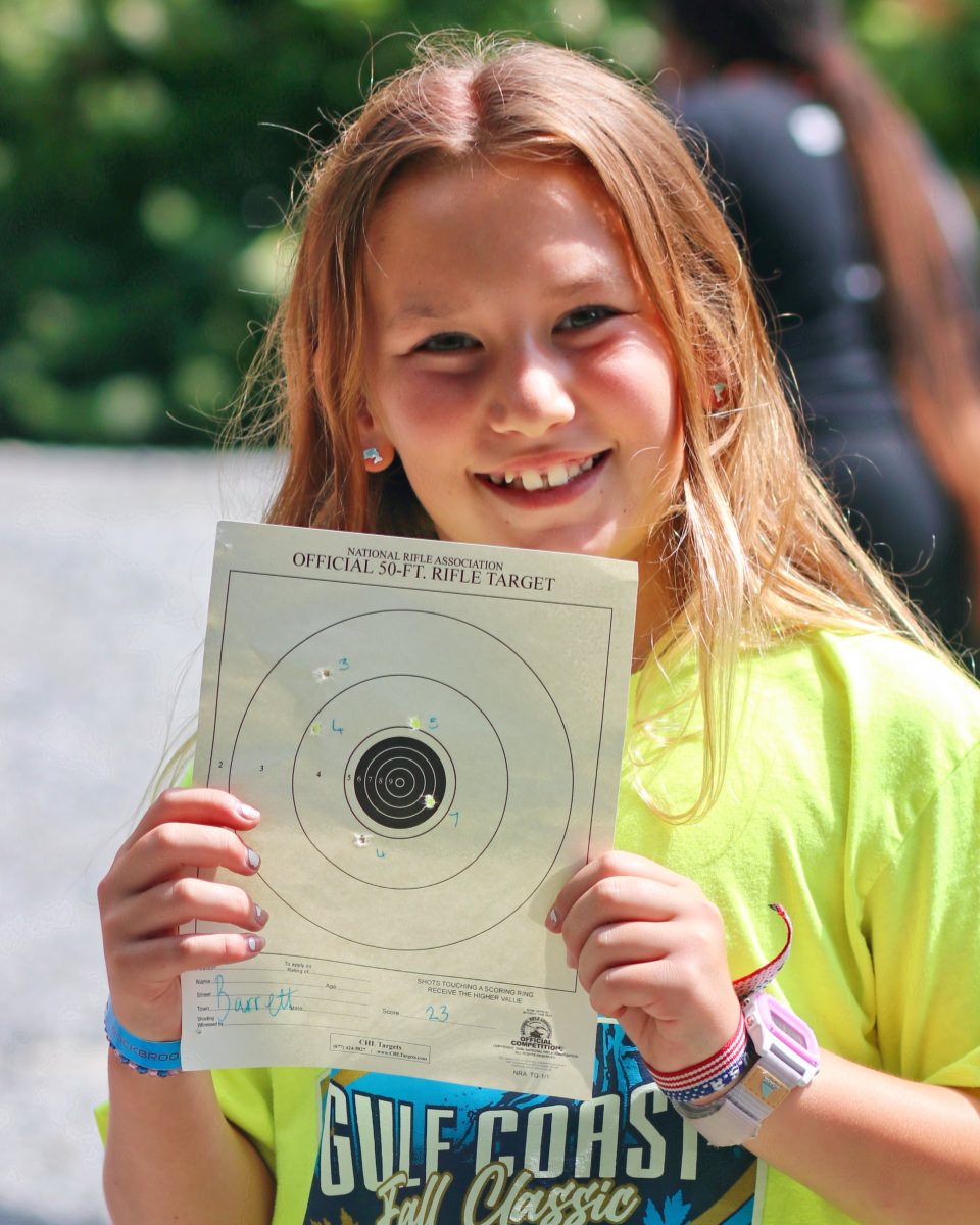 Girl holding Rifle target