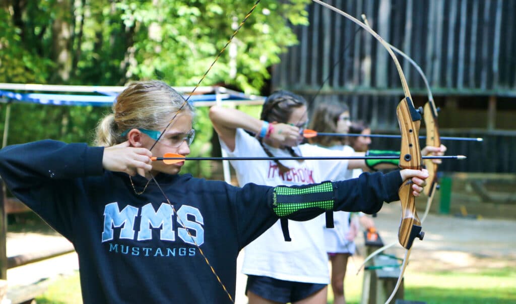 summer camp archery aiming girl